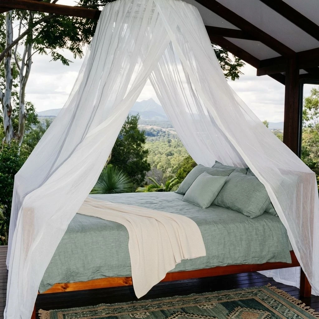 Cotton round mosquito net hanging from a single ceiling hook over a bed