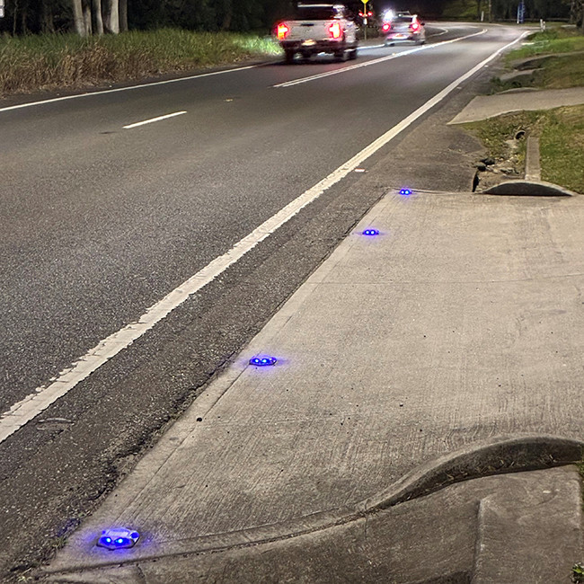 Blue solar road marker in use