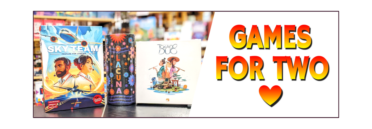 "Games for Two" banner beside three board games on a black tabletop