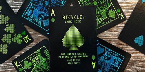 Close up of Ace of spades,   black background with bright green font/art