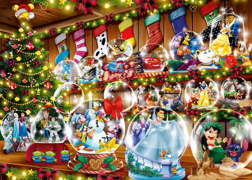 Close up of Disney Snow Globes on a counter, in front of a winter Holiday decorated space 