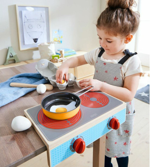 child playing with Culina Cooktop Set