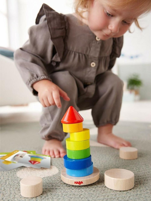 Child playing with block tower