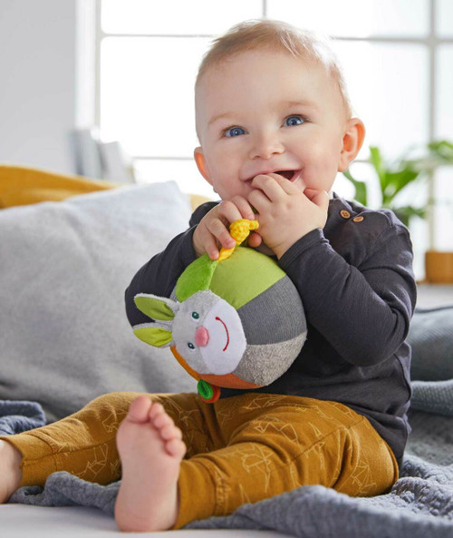 Infant playing with Soft Bunny Ball with Rattling Effects