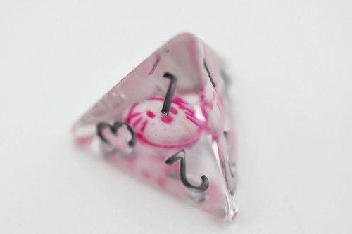Triangle die close up - clear dice with white and pink kitten head inside and silver numbers. 