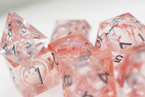 Full set of pink liquid core dice