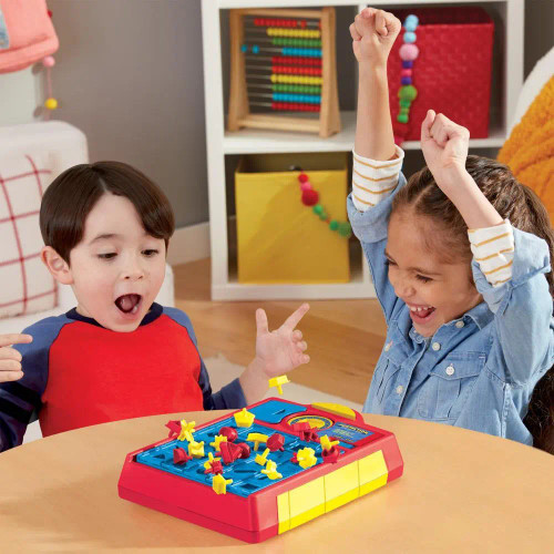 The pieces pop out of the tray as two children react