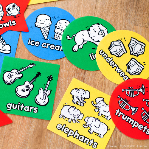 Cards of different shapes and colors depicting guitars, elephants, ice cream, trumpets and more