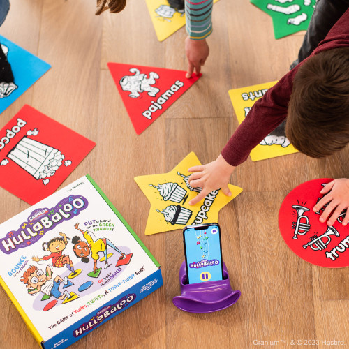 Example gameplay, a child player touches a yellow star on the floor that depicts cupcakes
