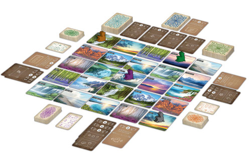 Sunset Over Water gameplay, with game pieces placed on cards depicting picturesque landscapes