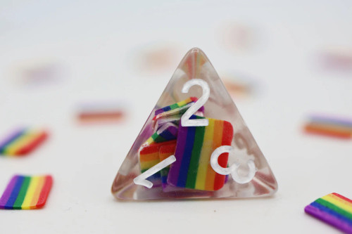 Close up of the Rainbow Flag four-sided die
