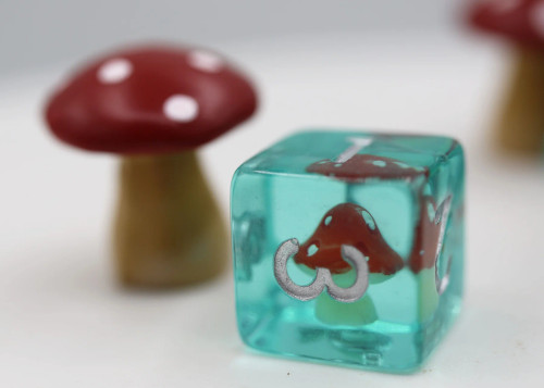 Power Up Mushroom six-sided die beside a mushroom model