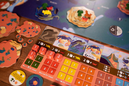 Artistically displayed Game components featuring dice and creature cards