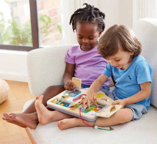 Two children playing with the Lock & Learn Playboard