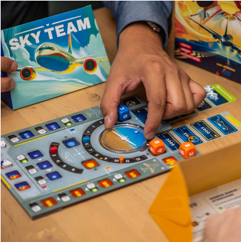 Sky Team gameplay, featuring dice placed in various places on a board