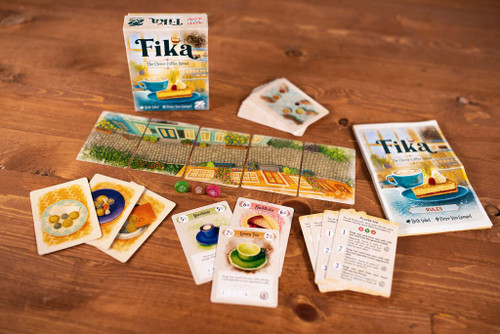 One players hand, tiles you'd find a café cards with player aid cards and a cute cobblestone  alley 
