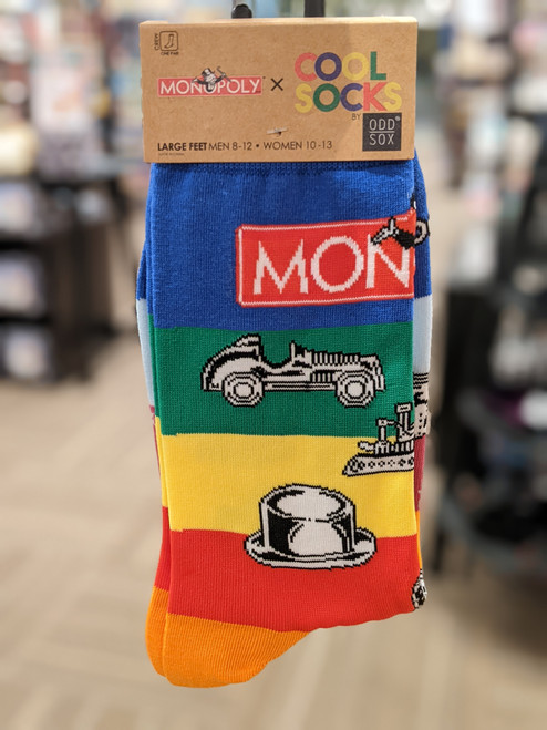 Monopoly pieces large socks on a plastic hangar