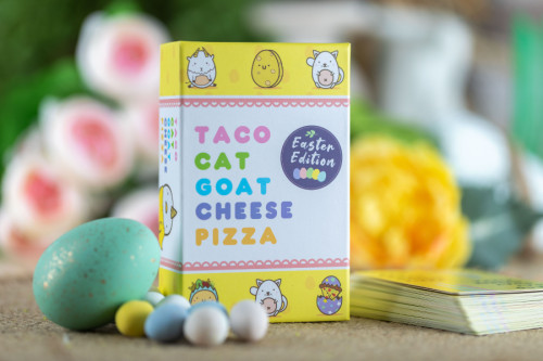 Taco Cat Goat Cheese Pizza Easter Edition box on a table with candy eggs