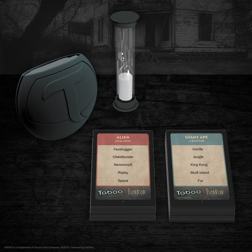 The game components with blue and red cards a black buzzer and sand timer