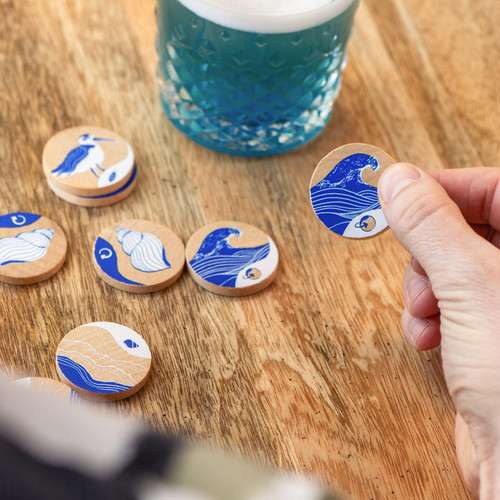  wooden tokens with blue beach creatures  