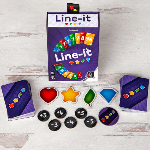 The game box and it's contents including cards, numbered tokens and 4 shapes