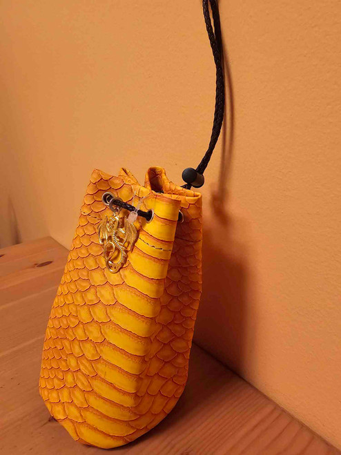 Dice bag appearing like dragon scale, with a gold dragon pedant side view