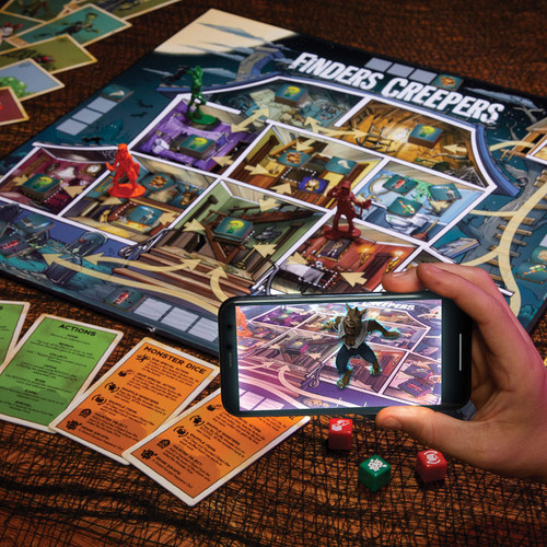 The board game set up to show the phone app interacting with the game