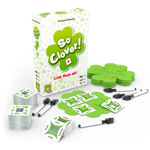 Front of game box surrounded by components, dry erase markers, clover plastic player boards, and the game cards