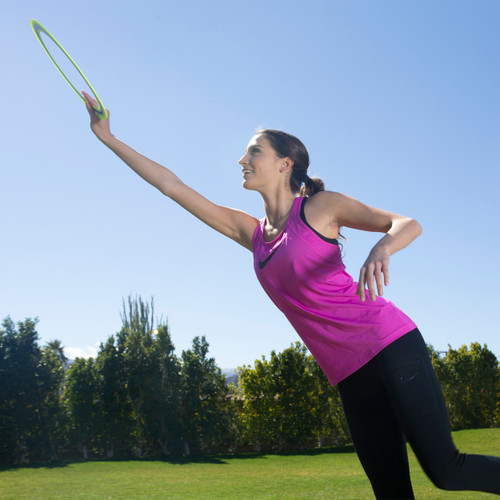 A person catches an Aerobie Pro Ring from the air