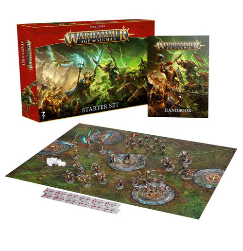 Several contents  including miniatures and game mat, in front of the red box