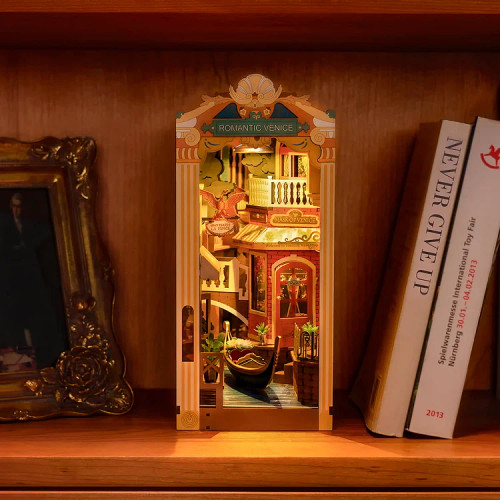 Book nook kit on a shelf with LED light turned on