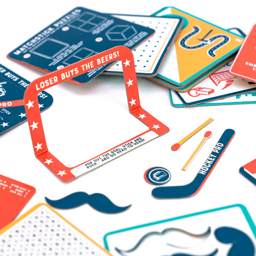 Select components, including a mini paper hockey goal & mustache