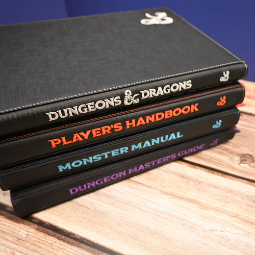 Stack of four covered books: Dungeons & Dragons sourcebook, Player's Handbook, Monster Manual and Dungeon Master's Guide