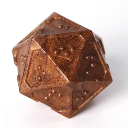 A 20-sided die (D20) from the Acrylic Molten Bronze braille dice set sits on a white background.