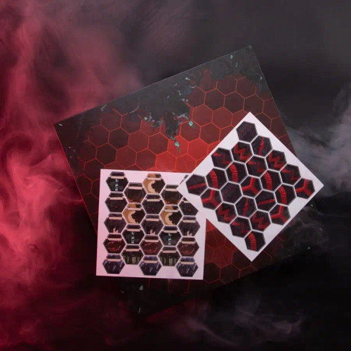 two sheets of stickers displayed in front of the black and red hex map