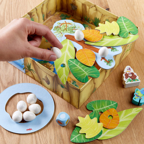 using the box as a game component, stacking leaves and eggs.