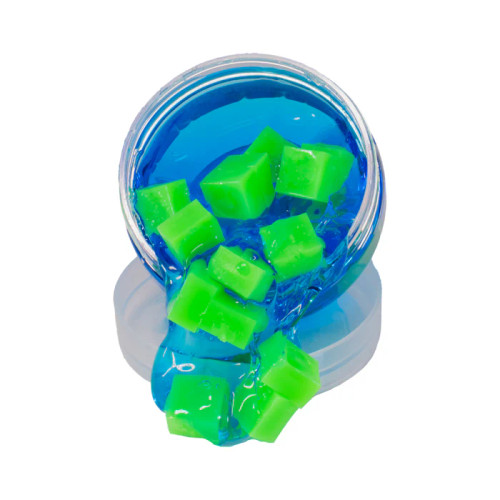 Green cubes and blue slime being poured out of a jar
