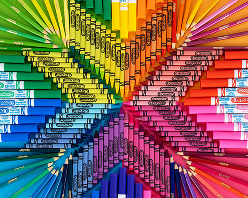 rainbow crayons and markers in a star pattern