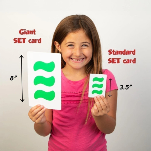 a comparison of the  original card game vs the giant sized card