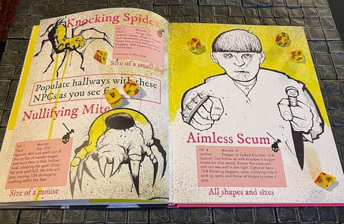 the open spread of book pages, red/pink font with yellow, pink and black and white art with spiders and fighter, dice not included