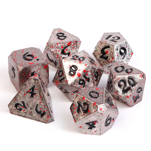 Silver tone dice with black numerals and blood splatter effect