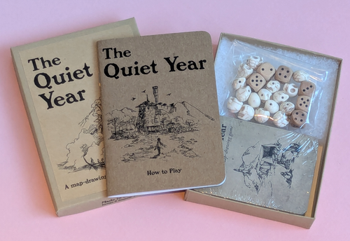 box open with a booklet, and contents with dice and skulls