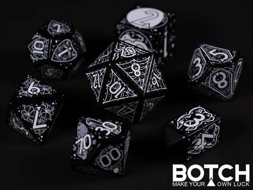 black dice with white numbers and design