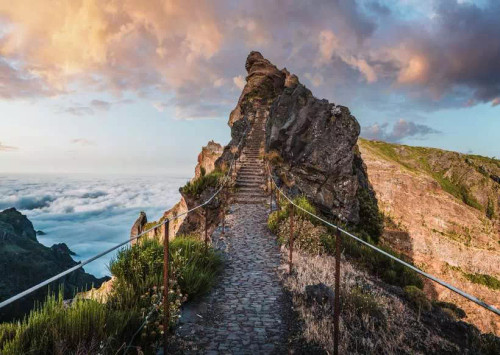 Puzzle image, depicting a path to a mountain peak above the clouds