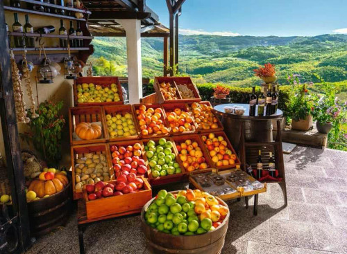 Puzzle image, depicting a fruit stall overlooking green hills