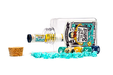 Bottle turned on its side with game contents spread around it