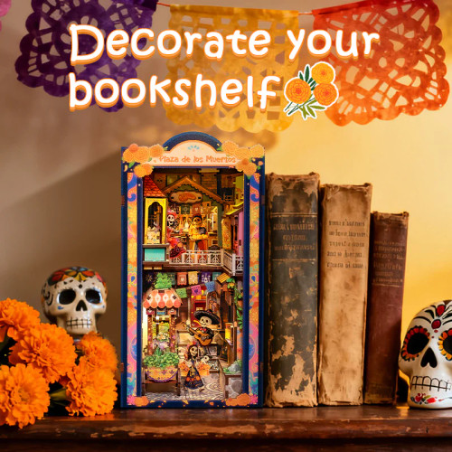 Completed model on a table with books and skull decor