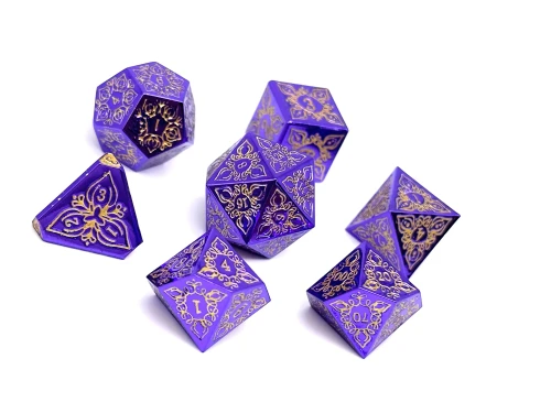 Purple metal dice set with gold numerals and etched details