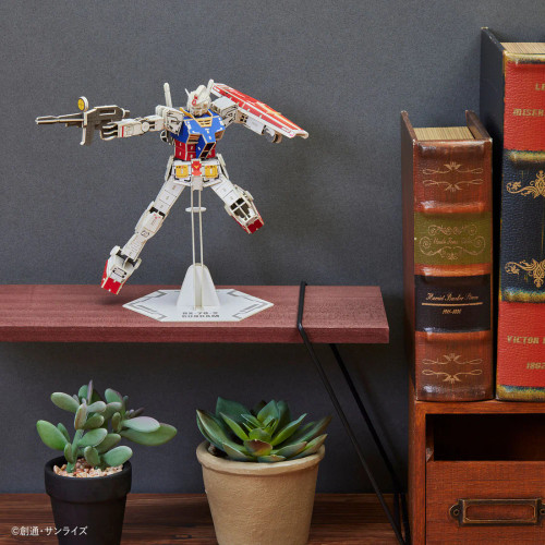 Model displayed on a shelf beside books