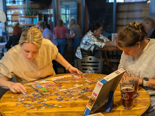 Two participants search for puzzle pieces